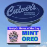 Outdoor digital screen and business sign.