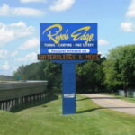 Outdoor business sign with digital screen.