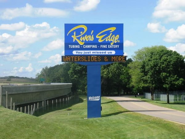 Outdoor business sign with digital screen.